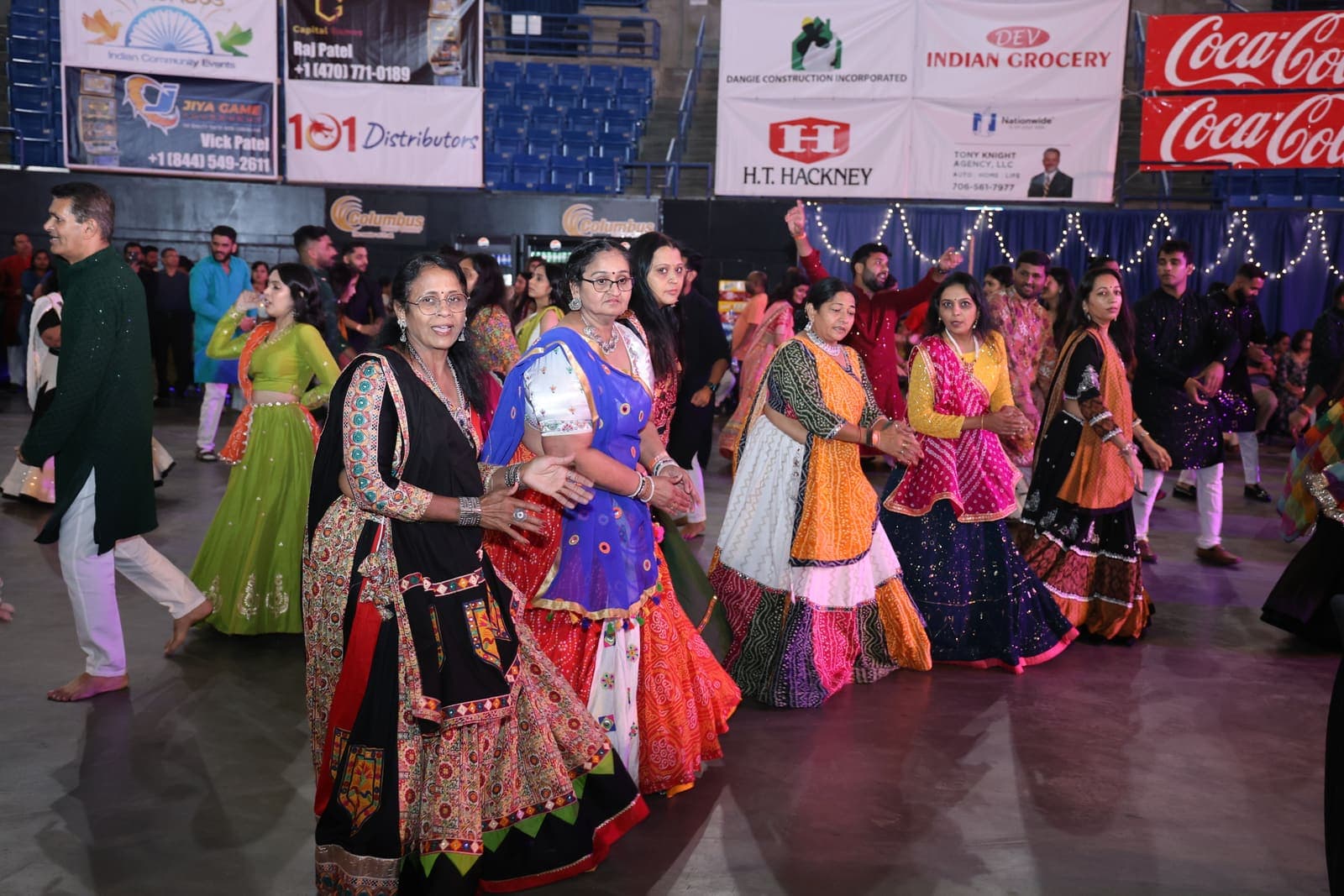 Garba dancers in traditional dress dancing in a circle
